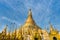 Shwedagon golden pagoda on blue sky background