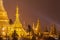 Shwedagon Pagoda at night with spotlight reflects gold surface of The pagoda