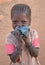 Shy child looking at camera, Burkina Faso