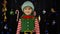 Shy shamed child girl in Christmas elf Santa helper costume posing looking camera and smiling