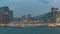 Shyline panorama timelapse day to night with towers and cruise liner in West Kowloon, Hong Kong.