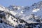Shymbulak gorge and mountains with ski slopes. Winter mountains landscape.