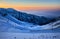 Shymbulak mountain resort snowy empty ski slope at sunset