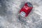 SHYMKENT, KAZAKHSAN - JANUARY 21, 2023: crumpled can of Coca Cola lies on the snow