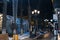 SHYMKENT, KAZAKHSAN - JANUARY 23, 2023: alley with lanterns and benches at night in winter