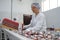 Shymkent, Kazakhstan - 03.12.2020 : Rakhat confectionery factory. Employees pack candy in branded boxes