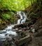 Shypit waterfall in springtime, amazing nature landscape, famous tourist destination in Carpathian mountains. Outdoor travel