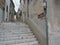 Sibenik, Croatia. A historic, typical Croatian street in the old town, with stairs leading to the St. Michael`s Fortress
