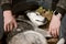 Siberian Husky dog lies next to owner, tired Husky dog with gray white coat color lying on ground