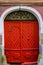 Sibiu, Romania, May 15, 2019: Traditional, colorful, decaying wooden courtyard doors of old townhouses in the center