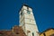 SIBIU, ROMANIA: Sibiu`s council tower in the small swuare on a sunny summer day with a blue sky in Sibiu