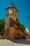 SIBIU, ROMANIA: A view over an old brick wall and a tower, which were a part of the fortification system in the old town of Sibiu