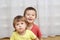 Sibling sitting together indoor