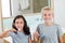 Siblings brushing their teeth in bathroom