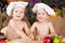 Siblings cooking in chef\'s hats