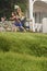 Siblings With Fishing Nets Running At Yard