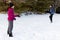 Siblings Having a Snowball Fight