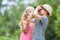 Siblings look through binoculars