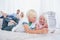 Siblings lying on the carpet using digital tablet