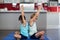 Siblings performing yoga at home