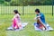 Siblings Practicing Yoga Outdoors