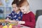 Siblings preparing decorations for Easter time