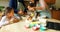 Siblings preparing food with family in kitchen 4k