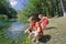 Siblings summer recreation activity outdoor game on Italian Tirino river bank