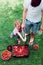 Siblings washing strawberries