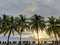 Sibolga, North Sumatra, Indonesia - October 7, 2021 : Sunset at the beach from a hotel with neatly lined coconut trees