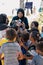 Sibuan, Malaysia - November 26, 2019: Visitors distributing snacks and goods to the Bajau Laut kids in their village