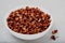 Sichuan pepper. Chinese pepper Zanthoxylum schinifolium in bowl on gray stone background