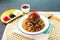 Sichuan Spicy Braised Beef with Fish Udon with chopstick served in bowl isolated on napkin side view of japanese food on table