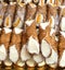 Sicilian cannoli with cheese and candied orange slices