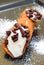 Sicilian cannolo stuffed with ricotta cheese cream and cho