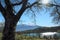 Sicilian landscape with pond and Etna Mount snow covered