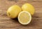Sicilian lemons and half fruit over wooden table