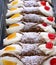 Sicilian pastries called cannoli stuffed with ricotta and candie