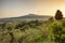 Sicilian rural landscape with Etna volcano eruption at sunset in Sicily