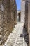 Sicilian souvenirs. Ancient, typical narrow and cobblestone street in Erice, Sicily, Italy