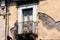 Sicily, facade of old baroque building in Catania, old street with traditional architecture of Italy