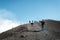 SICILY, ITALY - OCTOBER 1, 2018: People taking selfie on the peak of volcano Etna. The biggest active mountain volcano in Europe