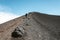 SICILY, ITALY - OCTOBER 1, 2018: People walking on the peak of Etna volcano. The biggest active mountain volcano in Europe