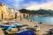 Sicily - old town Cefalu with fishing boats on the beach. Italy