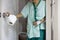 Sick asian senior woman with diarrhea,food poisoning hold tissue roll,opening the toilet door,elderly people have abdominal pain,