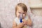 Sick baby girl use nebulizer mask for inhalation, respiratory procedure by pneumonia or cough for child