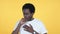 Sick Casual African Man Coughing Isolated on Yellow Background