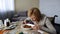 Sick disabled lady trying to eat dessert at table with pills, rehabilitation