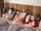 Sick family in protective masks  lying in bed