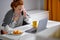 sick frustrated angry redhead girl making phone call to friend